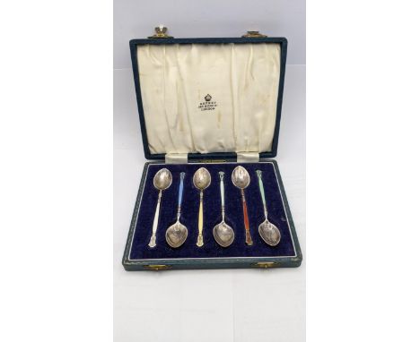 A boxed set of six silver an enamel Asprey coffee spoons hallmarked Birmingham 1964 total weight 69.3gLocation: 