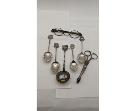 Silver and white metal items to include four silver spoons, a white metal and enamel Venetian spoon depicting St Michaels Squ