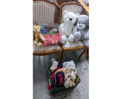 A collection of soft toys to include three Ty Beanie Babies in Perspex boxes, a Harrods 2004 bear, a Steiff 1925 replica bear
