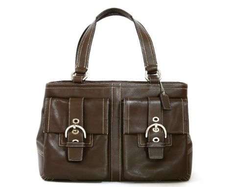 A Coach brown calf leather handbag, with contrasting white stitching, two exterior pockets with buckle fastening, silver-tone