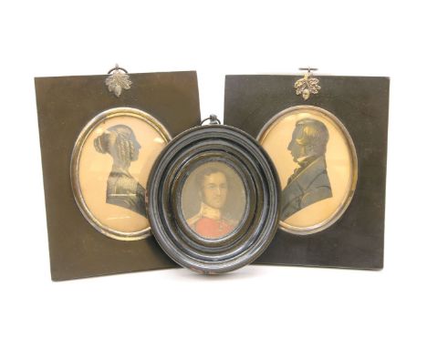 Two portrait silhouette portraits by Herve of Regent Street, in plain frames 14.5 x 12cm, and an oval portrait of an officer,