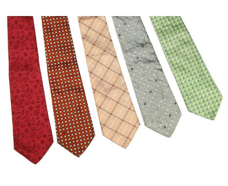 Five Loewe silk ties, to include an orange ground tie with spot design, a pink ground tie with black and white checker design