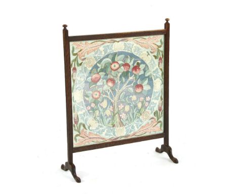An oak and embroidered firescreen,labelled `Beatrice, 1938', 63cm wide, 82cm high