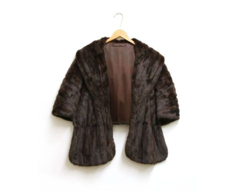 A mink fur jacket with silk lining, with leather cord tie at the neckline, and two Canadian squirrel jackets