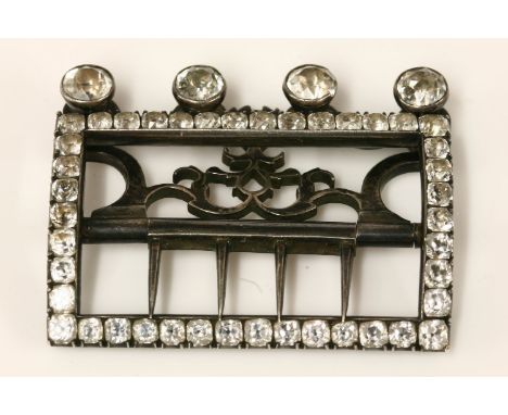 A sterling silver Georgian hinged buckle, set with white paste stones