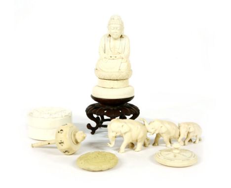 A collection of Japanese ivory, including a group of three elephants, Taisho period, a box with flowers, c.1930, a walrus man
