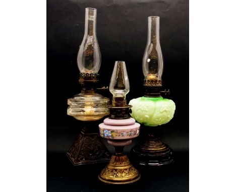A Victorian Duplex oil lamp of column form, with white opaque glass shade, 65cm high, together with three other oil lamps (4)