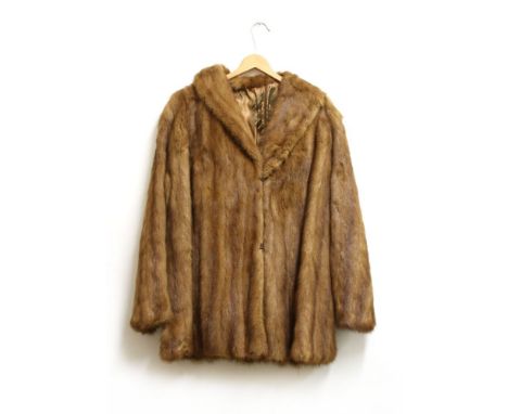 A blonde mink fur coat, and a caramel mink fur coat, both with silk lining