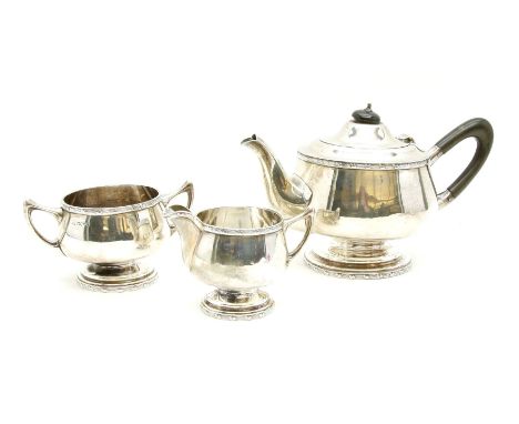 A silver three piece tea service, Walker &amp; Hall, Sheffield, 1925, 869g