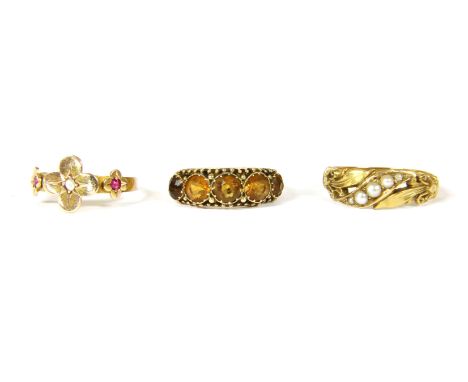 A 15ct gold five stone graduated citrine ring, size L, 2.14g, a 15ct gold three stone diamond and ruby ring, the central rose