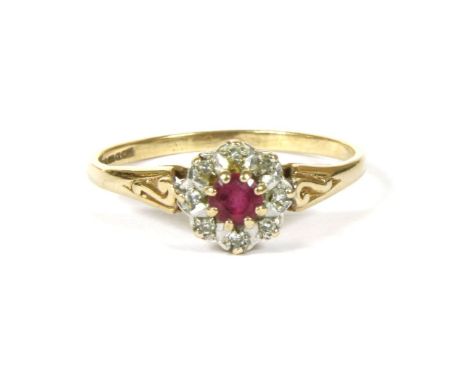 A 9ct gold ruby and diamond cluster ring, 1.58g