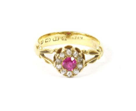 A ruby and diamond cluster ring, set to split shoulders (replacement shank made from a wedding ring), 3.34g