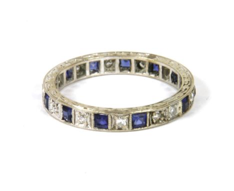 A white gold diamond and sapphire full eternity ring, size P, 3.38g