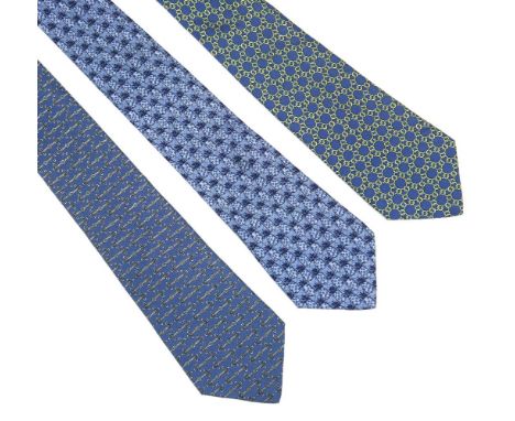 Three Hermès silk ties, to include a blue silk ground tie with a printed pineapple design, a blue silk ground tie with a prin