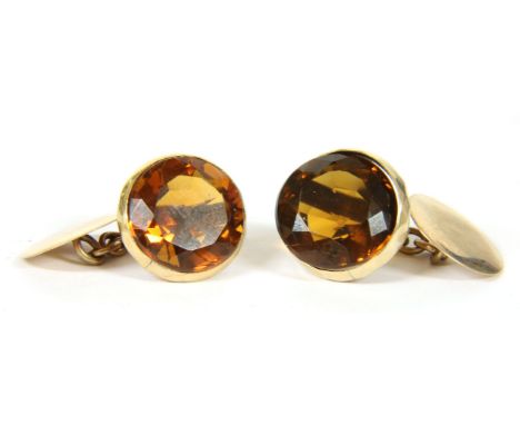 A pair of gold single stone citrine chain link cufflinks, tested as approximately 9ct gold (one stone loose)