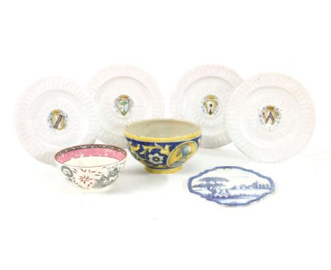 Four faience wall plaques, each with a central polychrome coat of arms, 33cm diameter, a Delft blue and white wall plaque, 37