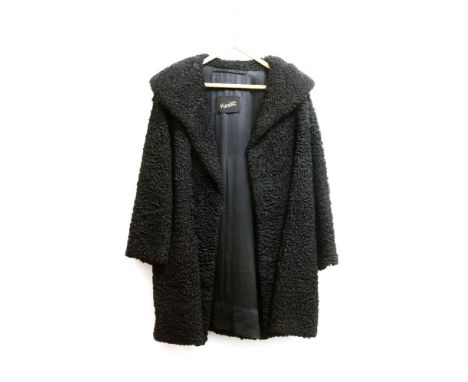 An Astrakhan mid-length coat, with black satin lining with Karter labels