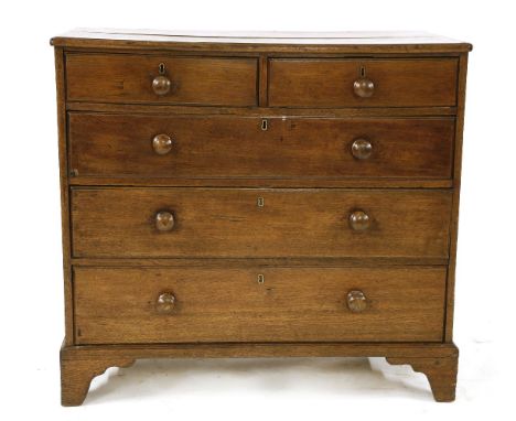 A 19th century oak chest of two short and three long drawers, with turned handles on bracket feet, 109cm wide, 51.5cm deep, 9