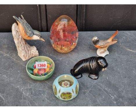 A small Moorcroft dish,&nbsp;8cm wide; together with two glass paperweights; two Hummel birds; and ebony Walrus. (6) 