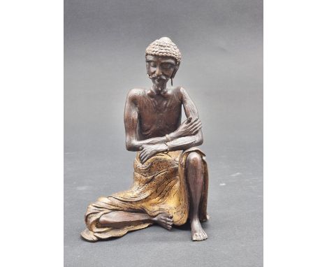 A Chinese bronze and parcel gilt figure of The Ascetic Sakyamuni, signed to base, 22cm high.&nbsp;&nbsp;  