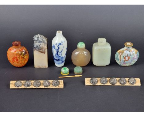 An interesting group of antique Chinese snuff bottles,&nbsp;to include a celadon jade example; together with a soapstone seal