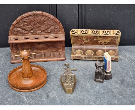 Tobacciana:&nbsp;a group of smoking related items, to include an oak novelty capstan pipe stand. (5) 