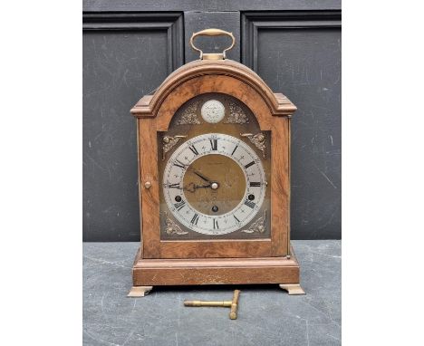 A walnut dome top mantel clock,&nbsp;by Elliott, striking on eight gongs, 37cm high. 