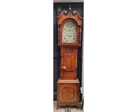 An early 19th century mahogany, oak and line inlaid eight day longcase clock,&nbsp;the 13in arched painted dial inscribed 'Wa