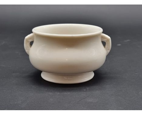 A Chinese blanc de chine twin handled censer, indistinct pressed seal mark to base, 13cm wide. 