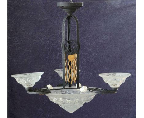 A French Art Deco wrought iron ceiling light, the central frosted glass shade decorated with roses and mounted with three bra