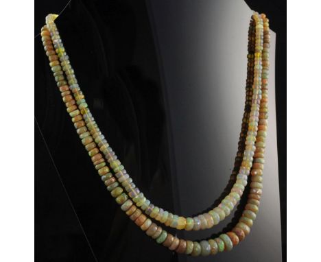 A double strand graduated facetted opal bead necklace, with 9ct gold circular clasp, 15in.