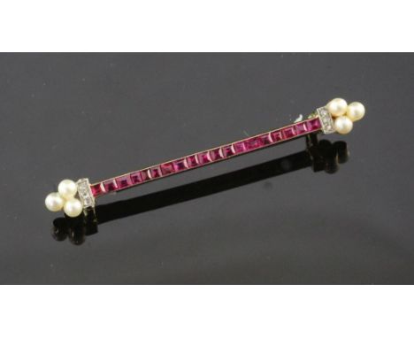 A 1920's/1930's French 18ct gold, ruby , diamond and seed pearl bar brooch by Lacloche Freres, Paris, set with nineteen rubie