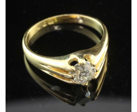 A mid 20th century 18ct gold and claw set solitaire diamond ring, the round old cut stone weighing approximately 1.00ct, size