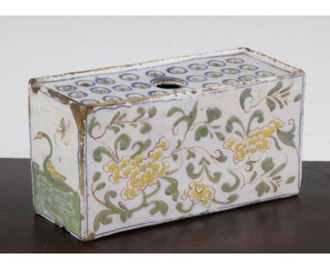 An English delftware polychrome flower brick, c.1760, possibly Liverpool, painted with yellow flowers to each side and geese 