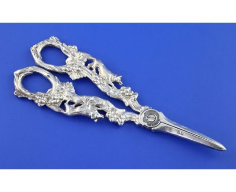 A pair of late Victorian silver grape shears, each handle decorated with a fox amongst fruiting vines, (lacking pivot boss), 