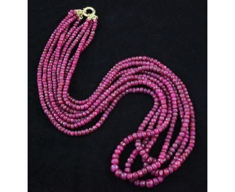 A quadruple strand facetted ruby bead necklace, with circular clasp, 22in.
