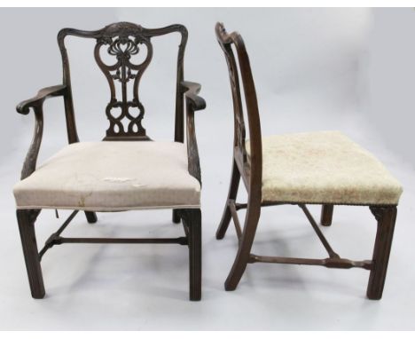 A set of eight mahogany Chippendale style dining chairs, two with arms, six singles, the carved and pierced splat backs, over