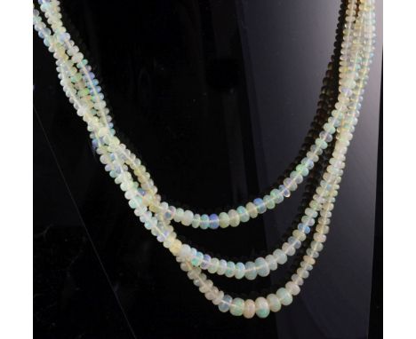 A 1960's triple strand graduated opal bead necklace, with gem set 9ct gold clasp, 16.5in.