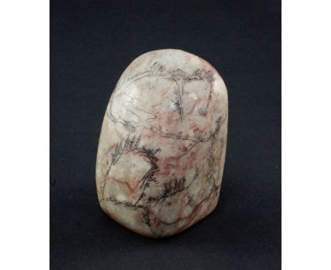 A Chinese soapstone scholar's seal, of boulder form, engraved with rockwork and trees and an inscription, 7cm.