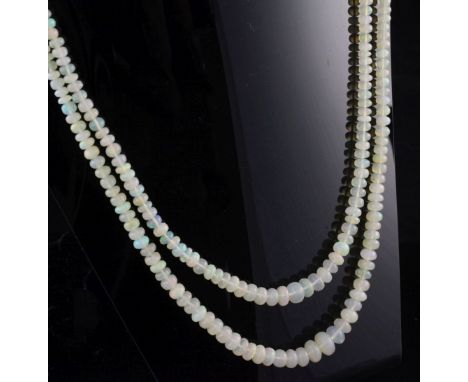 A double strand graduated opal bead necklace, with 14ct gold and coral set oval clasp, 18in.