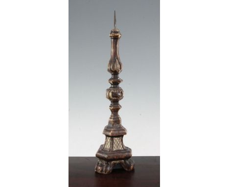 An 18th century Italian carved wood and gesso pricket candlestick, with knopped stem, decorated stylised leaves and C scrolls