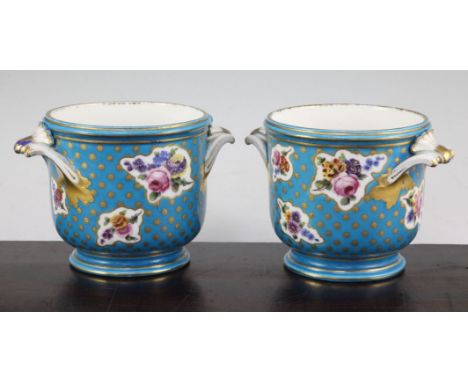 A pair of Minton Sevres style half bottle wine coolers, mid 19th century, each painted with floral sprays on a gilt dotted bl