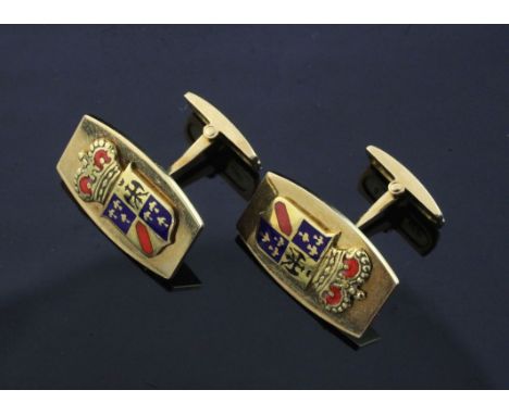 A pair of 18ct gold tonneau shaped cufflinks with two-colour enamel family crest appliques,, gross 14.4 grams.