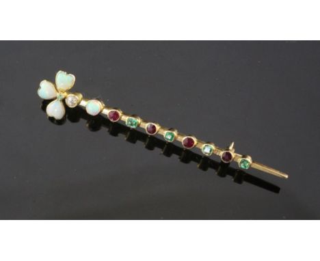 An early 20th century gold, white opal, diamond emerald and ruby bar brooch, the terminal set with heart shaped white opals, 