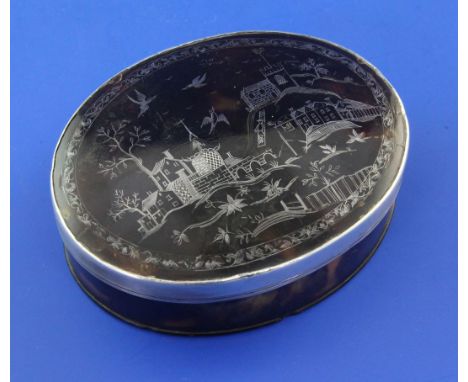 An 18th century tortoiseshell and silver pique oval table snuff box, with lid decorated with townscape and base inscribed " C