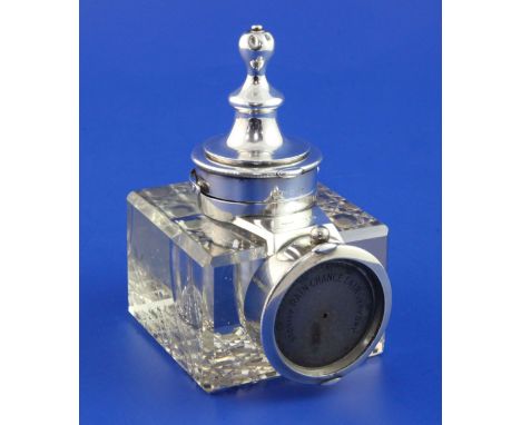 A George V silver mounted combination glass inkwell, pocket watch and barometer holder, of square form, lacking pocket watch,