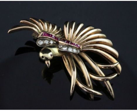 A continental 14ct gold, diamond and synthetic ruby set brooch, modelled as a bird on a branch with outstretched wings, gross
