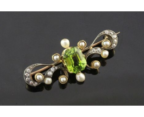 A late Victorian gold, peridot, diamond and split pearl set bar brooch, of scrolling design, 1.5in.