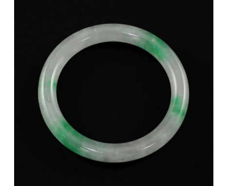 A Chinese ice white and emerald green jadeite bangle, 7.4cm.