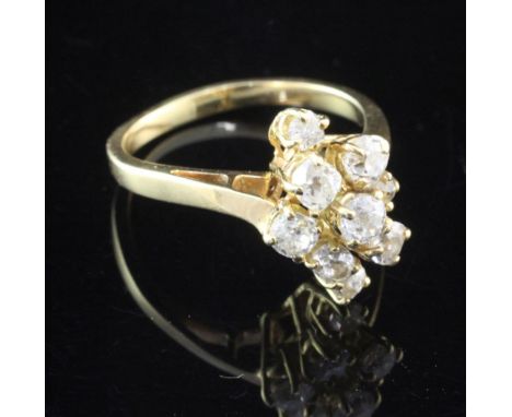 A French 18ct gold and diamond ring, of marquise design, set with nine graduated old cut diamonds, size Q
